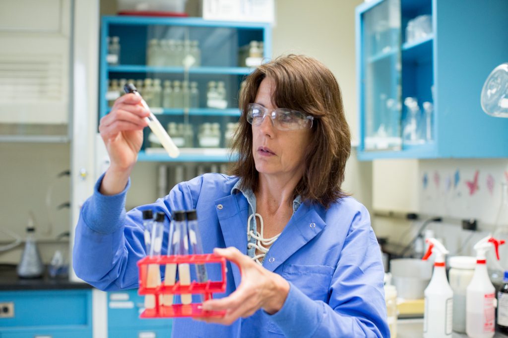 Staff chemist conducts sampling in the District lab.