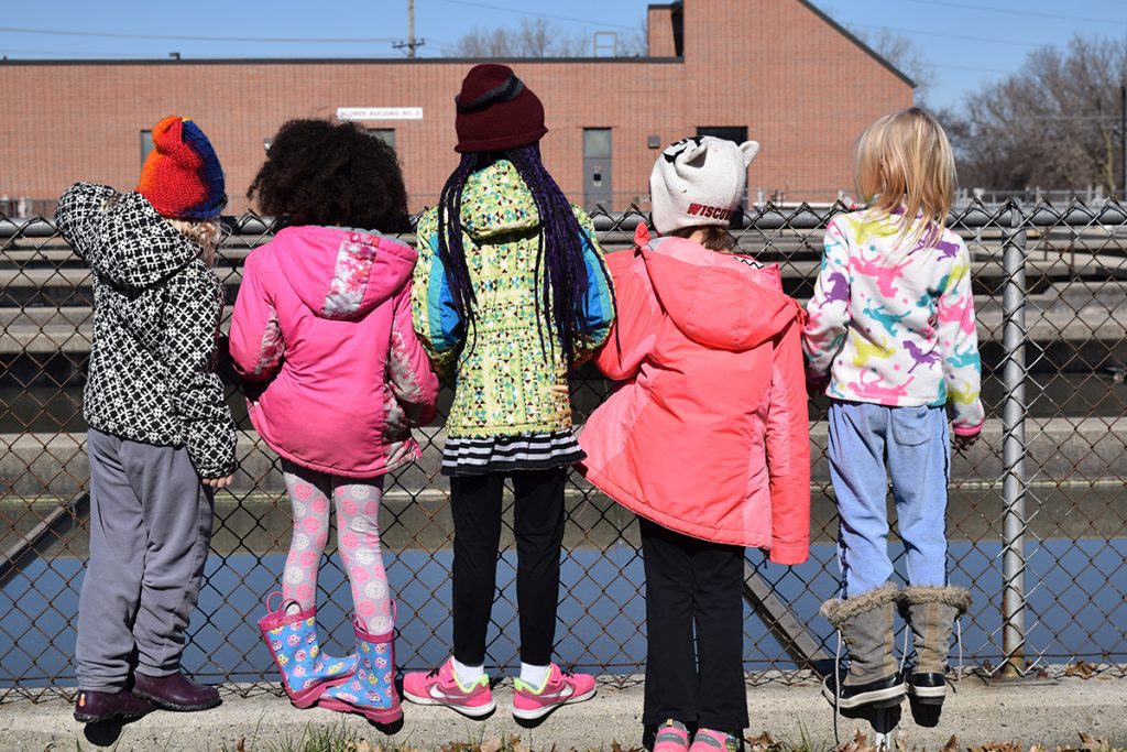 Children on a plant tour, looking at wastewater treatment pools, as part of District education & outreach programs.