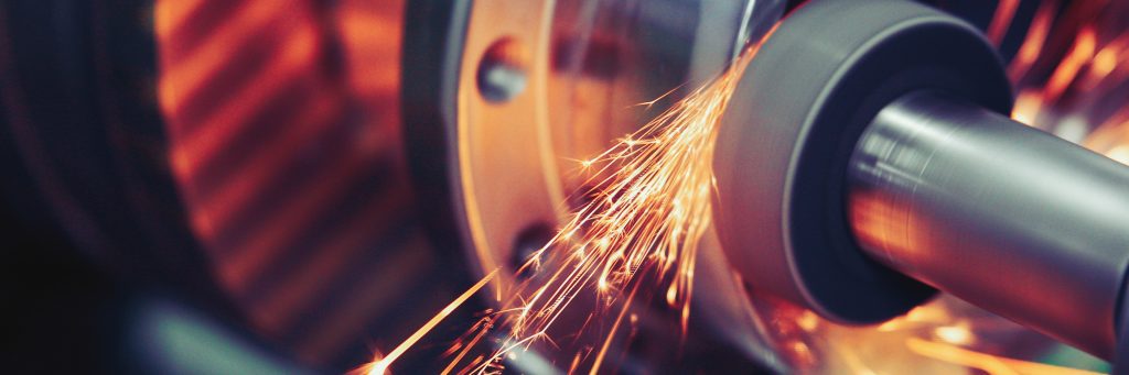 A closeup of grinding metal in an industrial facility that does business with us.