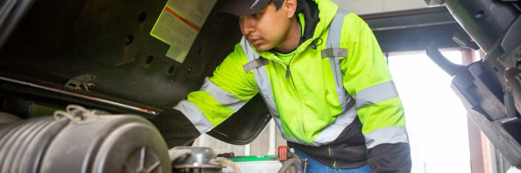 An engine mechanic inspects plant equipment for required maintenance.