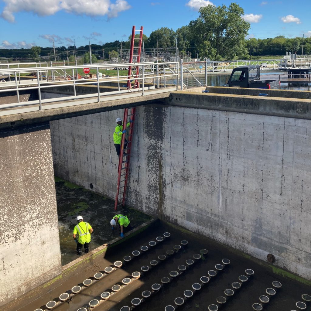 Staff enter and exit the aeration tank via a long climb on a ladder.