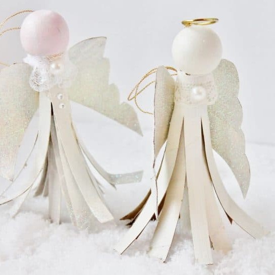 Angel Christmas ornament made from toilet paper rolls, lace, pearls and glitter.