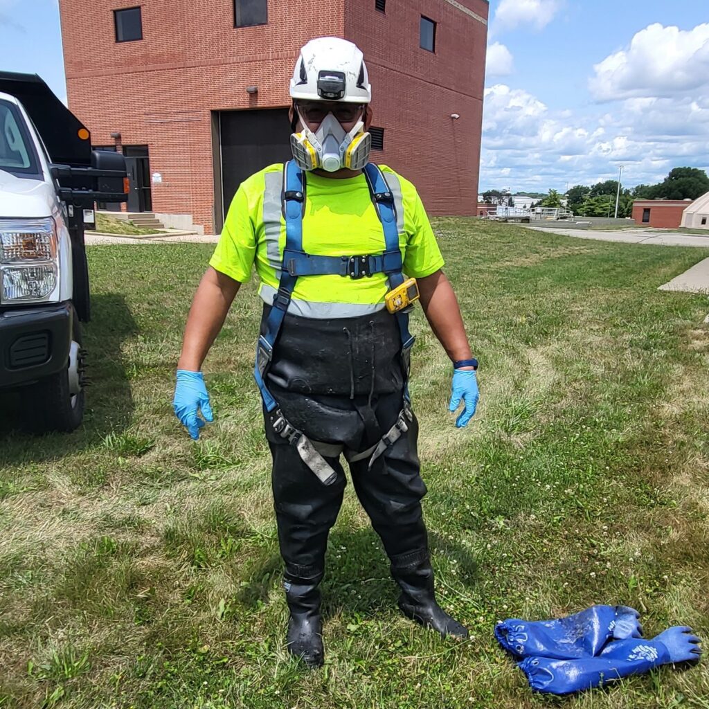 Rigoberto Ramon-Solis in his tank cleaning gear, which includes a dual cartridge respirator mask.