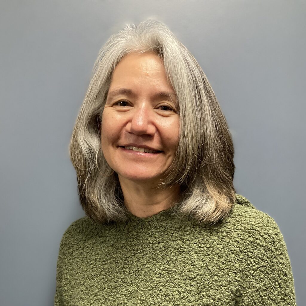 Headshot of Amy Bublitz as she poses in the IT department.