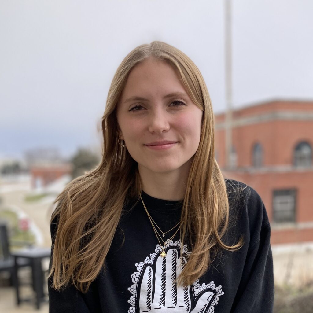 Lab apprentice Calista Mignon stands outside the District's Operations Building, where the lab is housed.