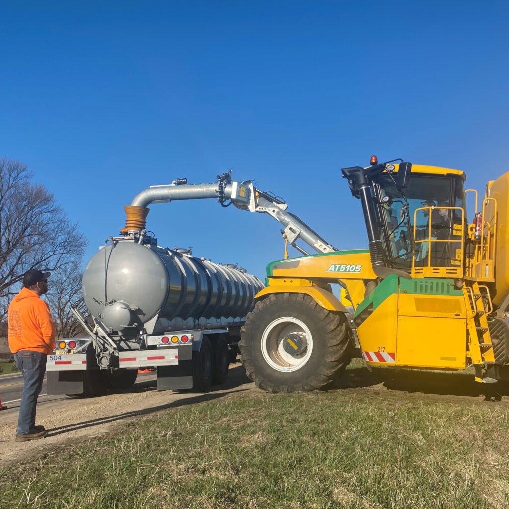 A Metrogro hauler fills the applicator in the field.