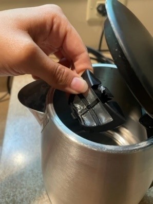 A mesh filter to catch minerals in a newer metal kettle.