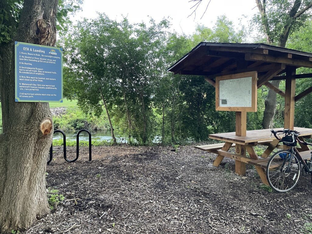 The CTH A Landing at Badfish Creek offers a covered picnic table, creek map and bike rack. (PC: Jim at Friends of Badfish Creek Watershed)