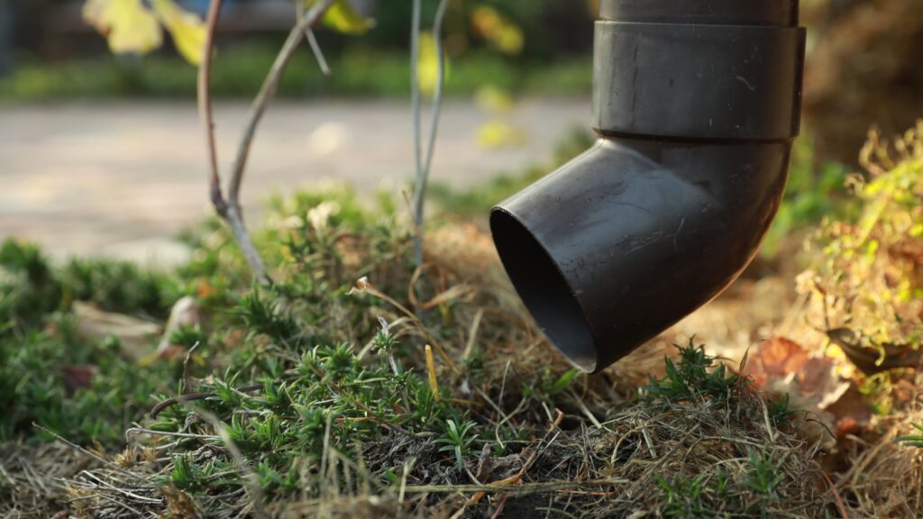 A properly configured outdoor downspout that discharges to vegetation and not the sewer system.