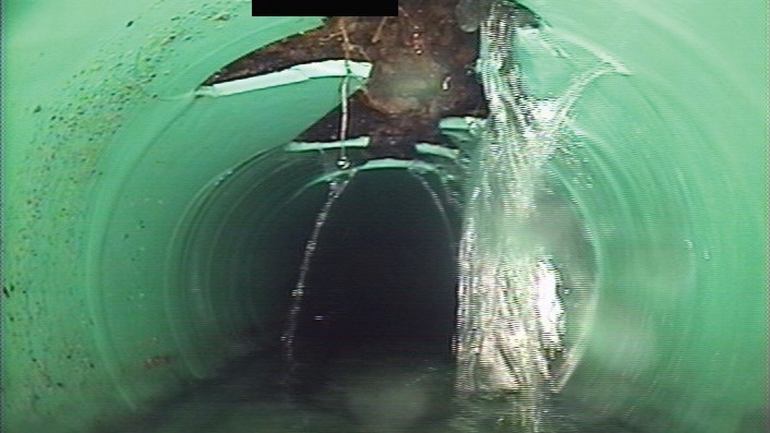 A video capture of infiltration from a cracked or broken private sewer lateral.