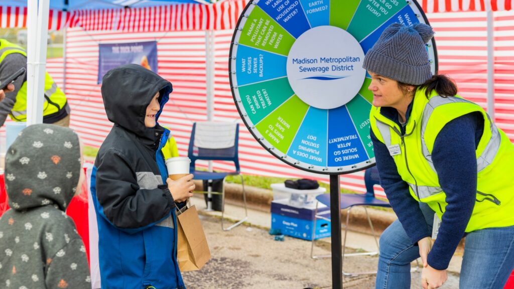 Families having fun playing mini carnival games as part of the Clean Water Showcase event.