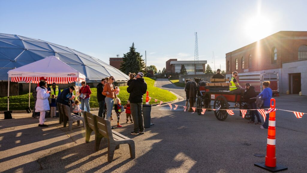Families having fun taking a tour of the plant as part of the Clean Water Showcase event.