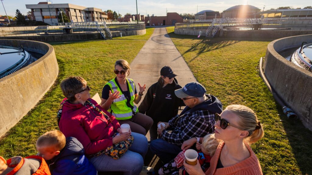 Families having fun taking a tour of the plant as part of the Clean Water Showcase event.
