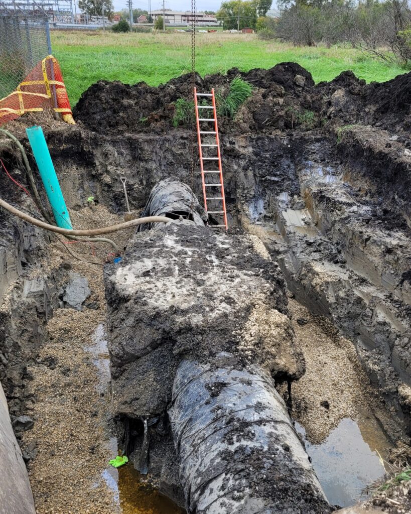 The emergency repair of the PS 2 force main pipe consisted of a repair clamp surrounded by a concrete collar.