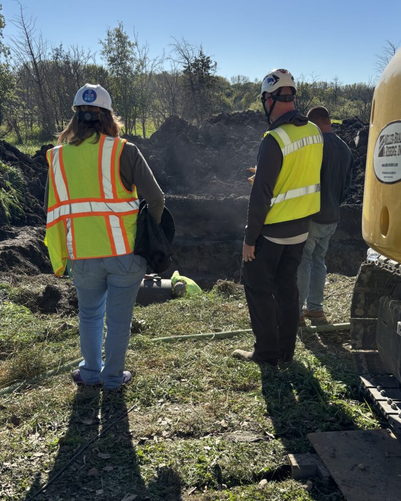 A rare look underground: engineers Lisa Coleman and Theran Jacobson observe the PS 2 force main repair work.