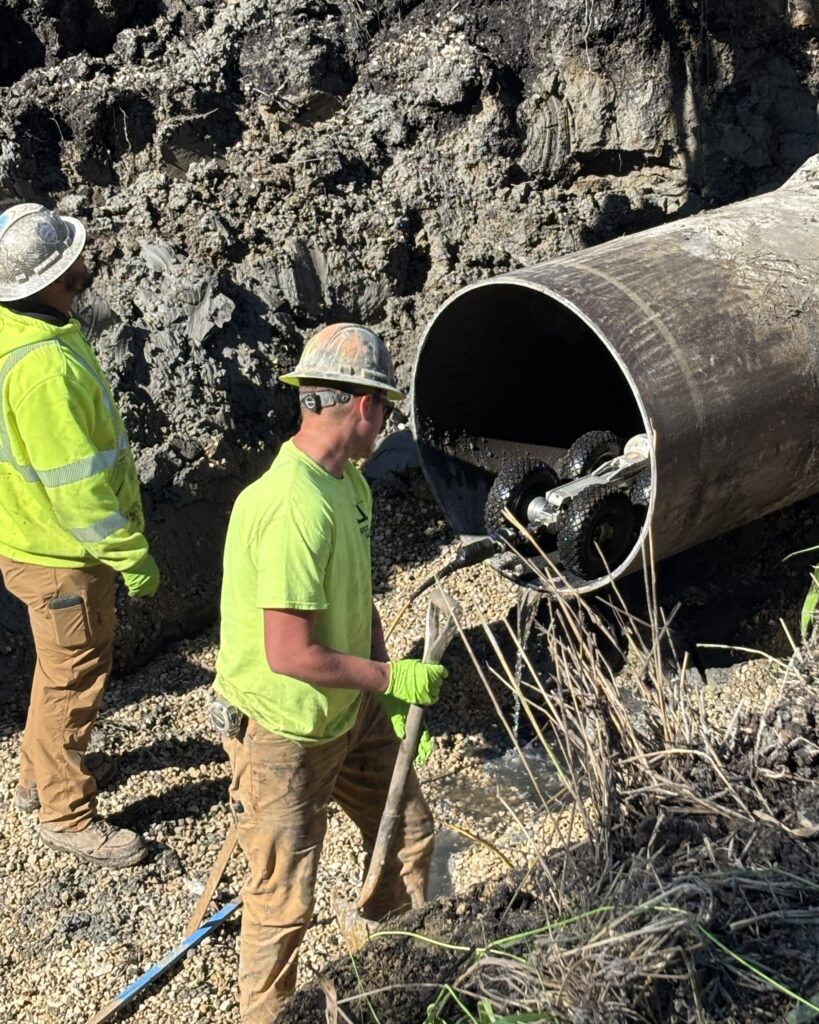 Capitol Underground and City of Madison workers facilitate televising the PS 2 force main pipe to assess its condition upstream and downstream of the damaged section.