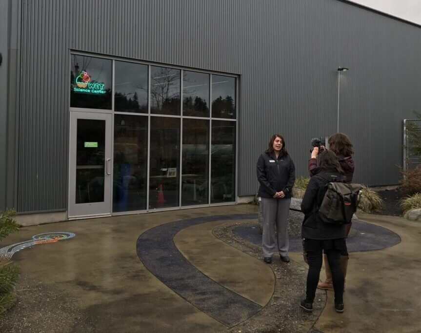 A small group gathers outside of the WET Science Center in Washington.