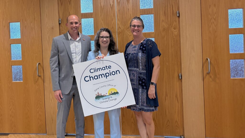 Eric Dundee and Kathy Lake, standing with Dane County Executive Melissa Agard, being honored as 2026 Climate Champions in three categories